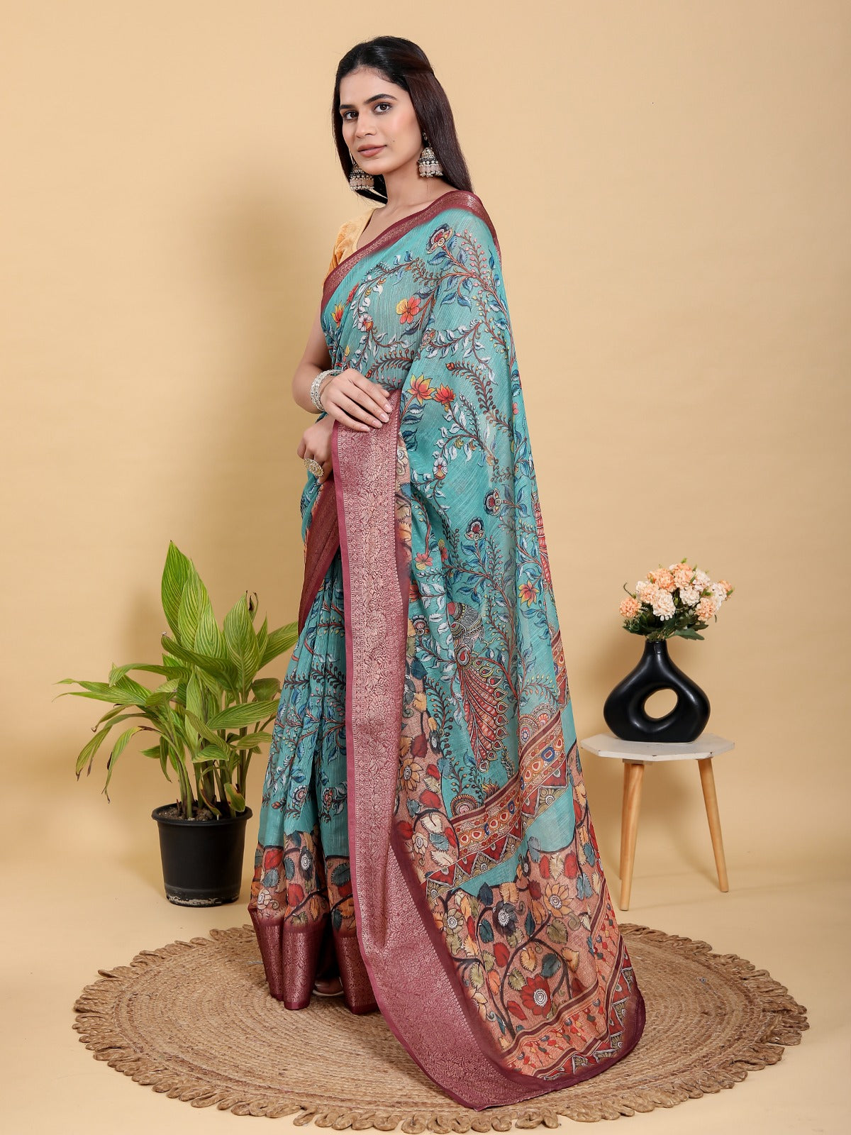 Teal Blue Printed Saree with Traditional Motifs and Zari Border
